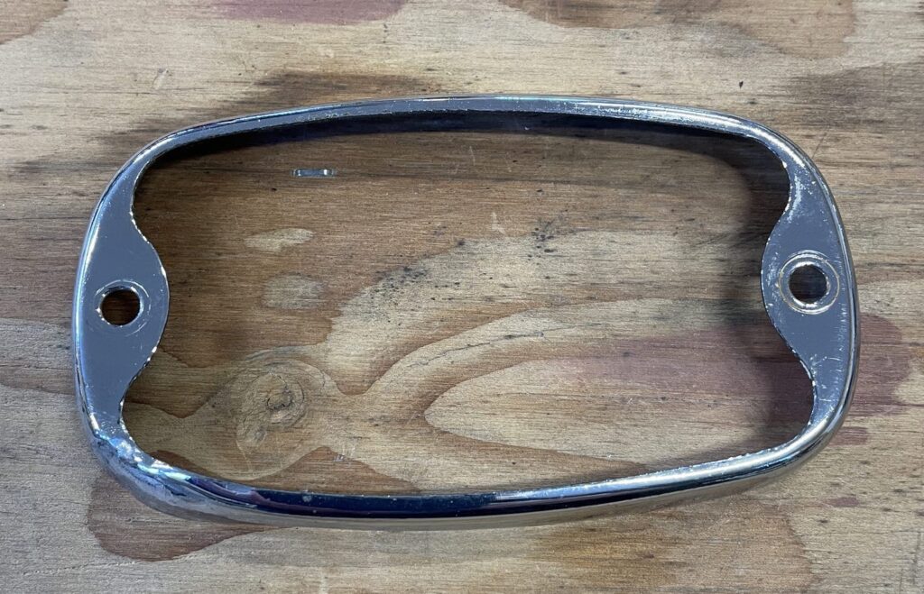 Triumph reverse light chrome bezel